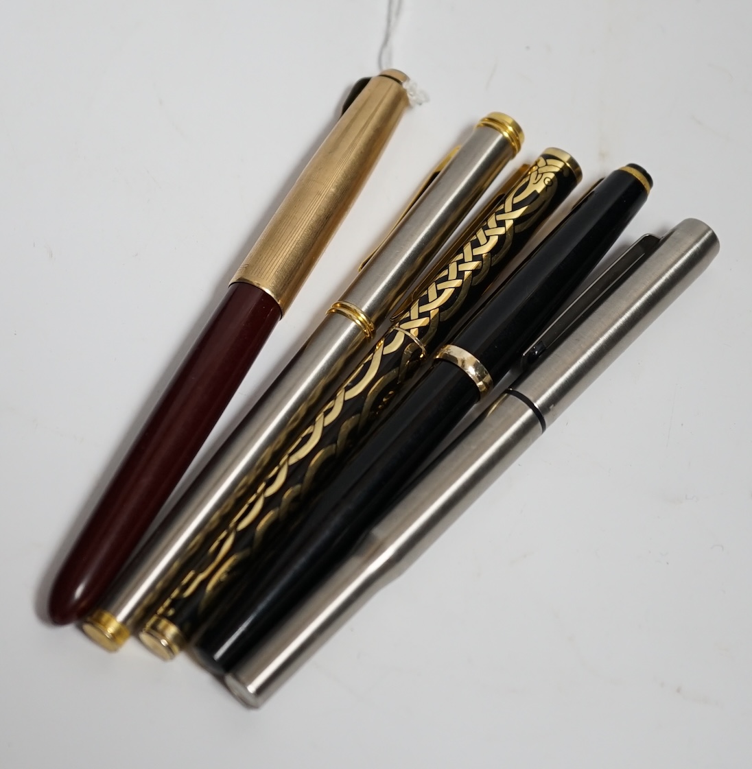 Five various pens including Parker and Reform
